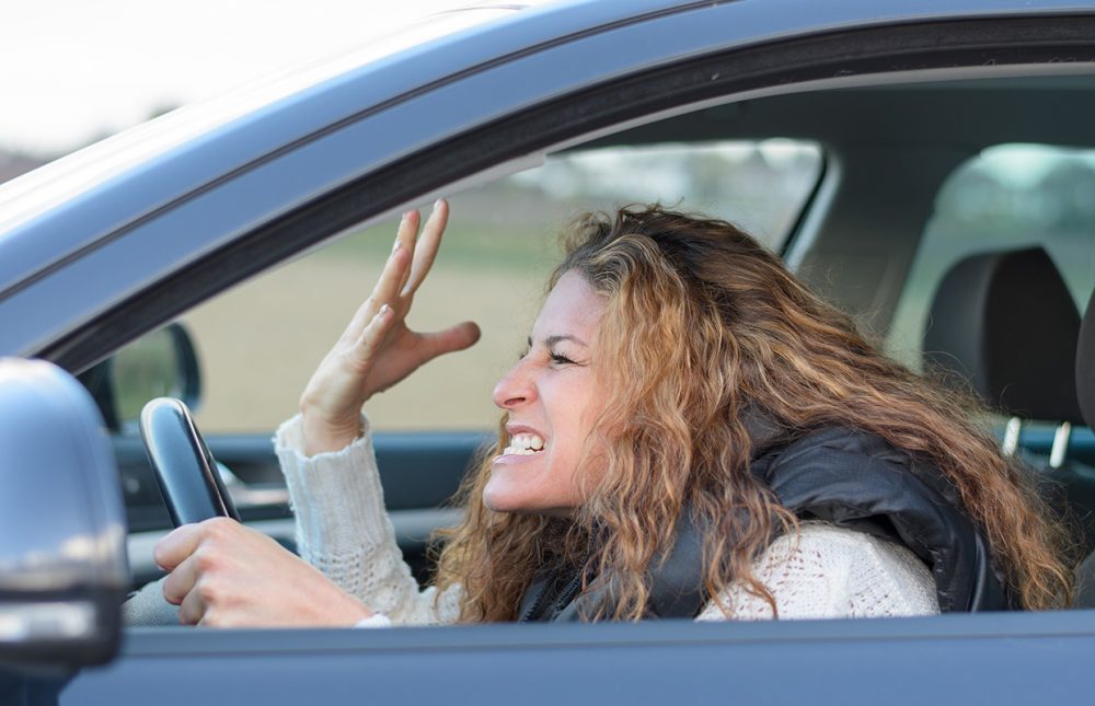 Woman,Is,Driving,Her,Car,Very,Aggressive,And,Gives,Gesture